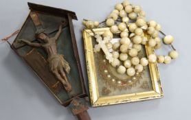 An 18th/19th century mother-of-pearl rosary and a painted wood crucifix and a wax icon