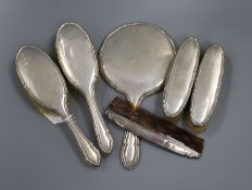 A silver mounted six piece dressing table set.