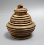 A ring turned treen bowl with double cover, height 17cm. By repute Ex. W.J.S. Shepherd Collection