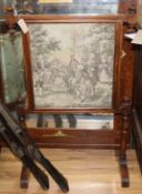 A late Victorian mahogany firescreen with an inset machined tapestry panel W.66cm