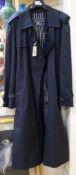 A Burberry navy blue trench coat, size 52R