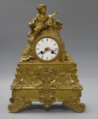 An ormolu figural mantel clock with silk suspension Height 34cm