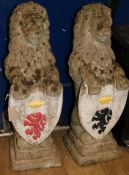 A pair of reconstituted stone garden heraldic lions