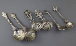 A pair of late Victorian silver serving spoons, a pair of Dutch silver silver spoons with import