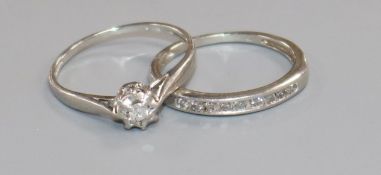 A platinum and illusion set diamond ring and a platinum and nine stone channel set diamond half