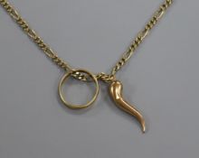 A 9ct gold chain hung with a 22ct gold band and a yellow metal horn of plenty charm.