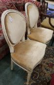 A pair of French painted salon chairs