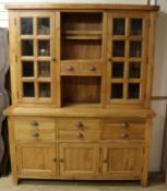 A modern oak dresser with cabinet top W.160cm