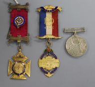 A 9ct gold medal and two others
