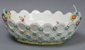 A Derby oval basket, c.1760, with 'blind' basket weave moulded exterior, the interior painted with