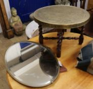 A Benares brass table and an oval mirror 60cm and 77cm