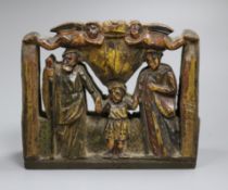 A Sicilian carved and painted wood religious group with Palermo retailer's label, width 18cm, 15cm