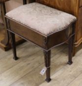 An Edwardian carved mahogany box seat piano stool W.61cm