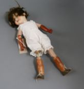 An Armand Marseille 390 open mouthed bisque headed doll, with overpainted body and a small