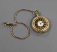 An 18ct gold engraved and enamelled ladies' half hunter pocket watch on gold chain (tests as 14ct)
