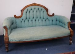 A late Victorian carved walnut upholstered settee W.158cm