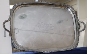A George V silver rectangular two handled tea tray, with shell and gadrooned border, Thomas Bradbury
