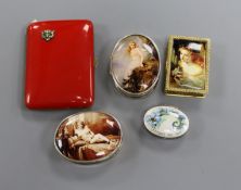 Two oval silver pill boxes decorated with erotic scenes and three other items, including a red