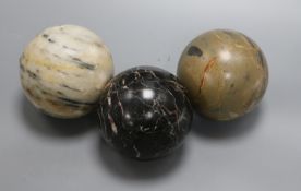 Three marble carpet balls