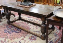 A James I style carved oak refectory table W.183cm