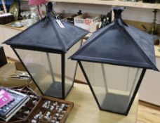 A pair of hanging or free-standing lanterns