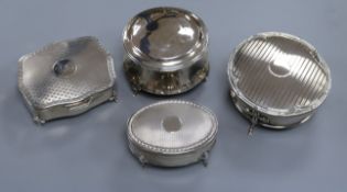 Four early 20th century silver trinket boxes, including a plain circular box on three scrolled feet,