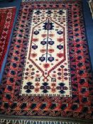 A North West Persian ivory ground rug 190 x 112cm