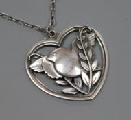 A Georg Jensen sterling silver heart shaped robin pendant, no. 97, on chain, pendant 40mm.