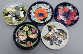 Five Moorcroft pin dishes, including 'Puffins', 'Strawberry Thief', 'Anemone', 'Bramble' and '