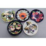 Five Moorcroft pin dishes, including 'Puffins', 'Strawberry Thief', 'Anemone', 'Bramble' and '