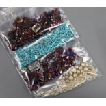 Four jewellery bags containing assorted unmounted and cut gemstones.