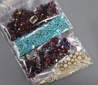 Four jewellery bags containing assorted unmounted and cut gemstones.