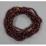 Three assorted garnet bead necklaces.