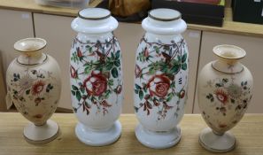 A pair of French 19th century opaline glass tall vases, decorated with rose sprays on a white ground