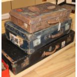 Three leather suitcases, two with liner labels