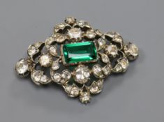 An early 20th century white metal, green and white paste set lozenge shaped brooch, 53mm.