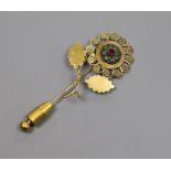 A French 18ct yellow metal enamel and paste? set flower head stick pin, overall 65mm.