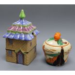 A Clarice Cliff Fantasque Bizarre 'Orange Trees and House' preserve pot and cover, shape 230 and a