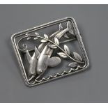 A Georg Jensen sterling silver twin dolphin and scrolling leaf branch rectangular brooch, no. 251,