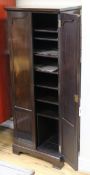 A 1920's mahogany two door sheet music cupboard W.51cm