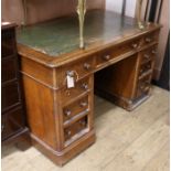 A Victorian mahogany pedestal desk, fitted with nine small drawers W.122cm