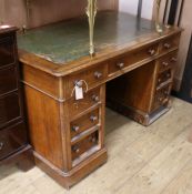 A Victorian mahogany pedestal desk, fitted with nine small drawers W.122cm