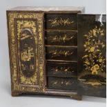 A 19th century Chinese black-lacquered and gilt-decorated table cabinet, fitted a pair of doors