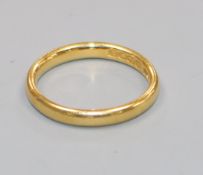 A 22ct gold wedding band.