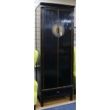 A Chinese lacquer tall wardrobe W.80cm