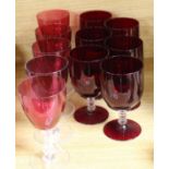 A collection of eleven various red bowled wine glasses