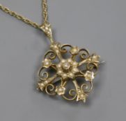 An Edwardian 9ct gold and seed pearl set pendant brooch, on a later 9ct gold ropetwist chain,