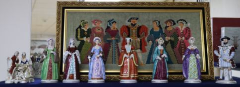 A Sitzendorf set of Henry VIII and his Six Wives, another figure and a needlework panel.