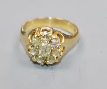 A yellow metal and old cut diamond cluster ring, size K/L.