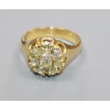 A yellow metal and old cut diamond cluster ring, size K/L.